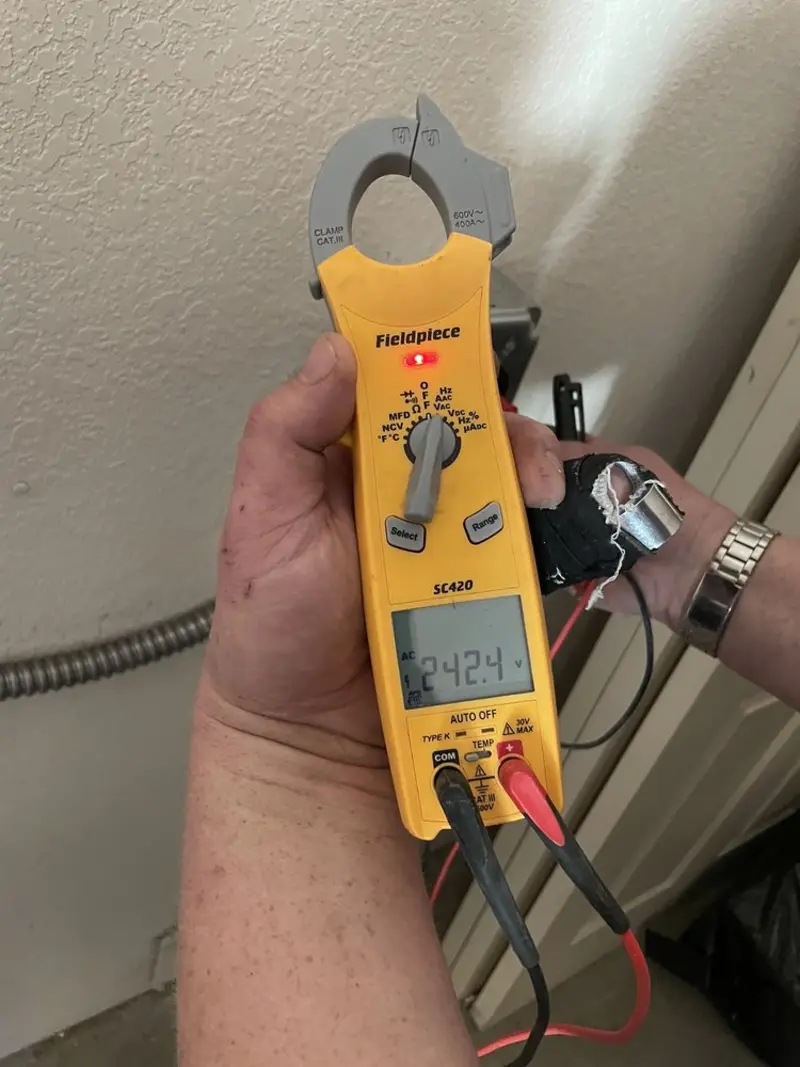 Voltage testing with clamp meter during Ceiling Fan Installation in Perris